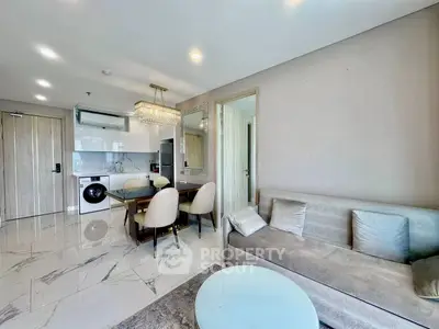 Modern living room with elegant dining area and built-in appliances