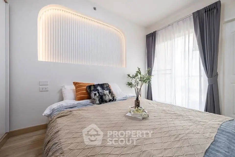 Modern bedroom with stylish lighting and cozy decor