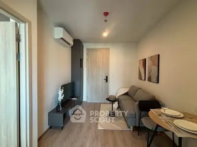 Modern living room with stylish decor and compact furniture