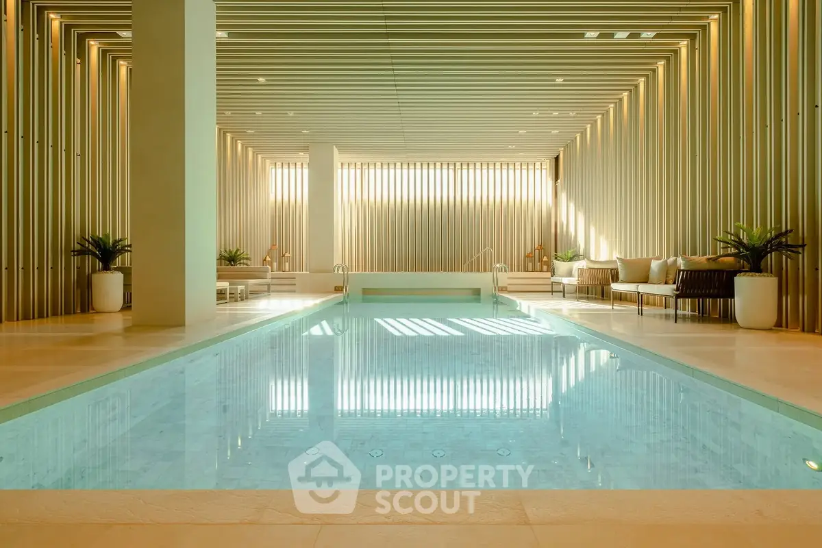 Luxurious indoor pool with modern design and elegant seating area