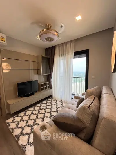 Modern living room with cozy sofa, stylish TV unit, and balcony view.