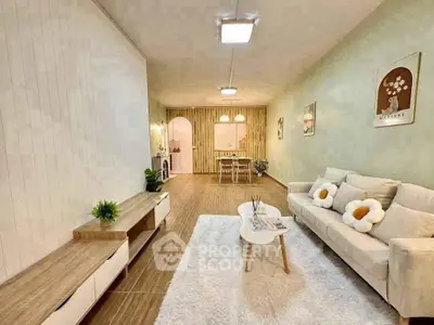 Spacious living room with modern decor and cozy dining area, perfect for family gatherings.