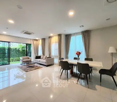 Spacious modern living room with garden view and elegant decor