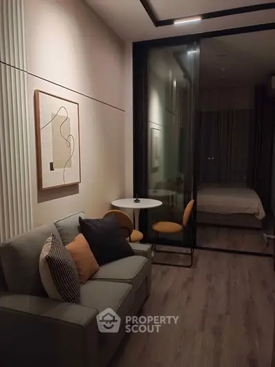 Modern living room with cozy sofa and stylish decor in a contemporary apartment.