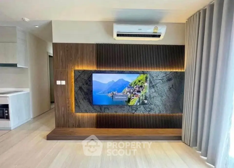 Modern living room with stylish TV wall and air conditioning