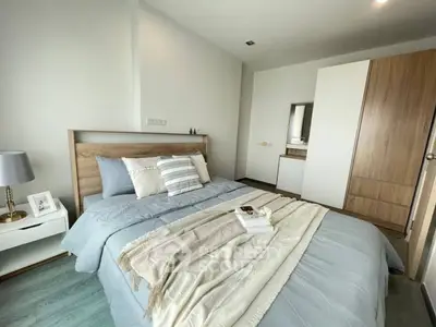 Cozy modern bedroom with stylish decor and wooden accents