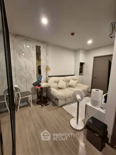 Modern living room with cozy sofa and stylish decor