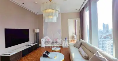 Luxurious living room with stunning city view, elegant chandelier, and modern decor.