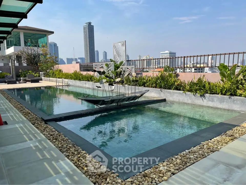 Luxurious rooftop pool with stunning city skyline views and modern design.