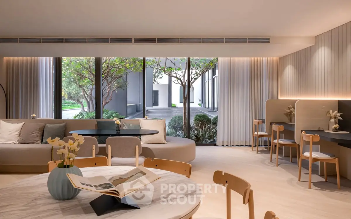 Luxurious modern living room with large windows and elegant decor