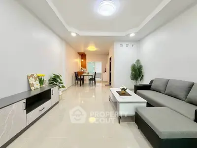 Spacious modern living room with elegant decor and open layout, perfect for family gatherings.