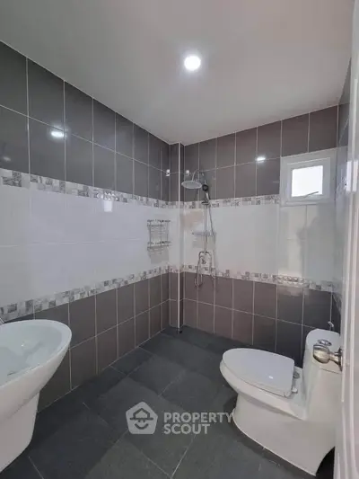 Modern bathroom with sleek tile design and contemporary fixtures