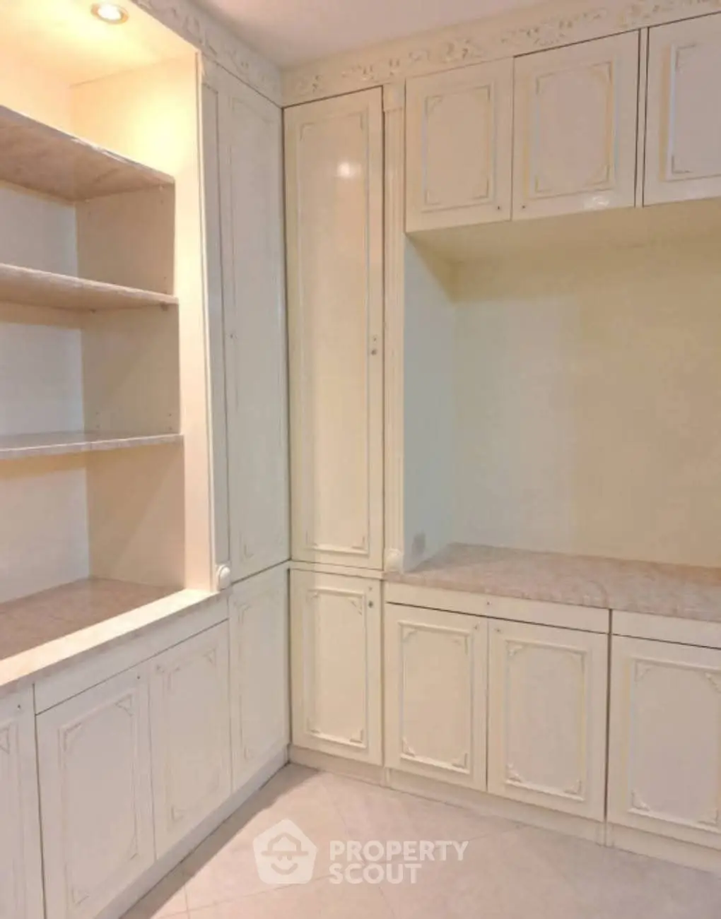 Spacious storage area with elegant cabinetry and ample shelving