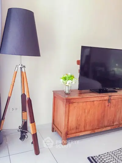 Stylish living room with modern floor lamp and wooden TV stand