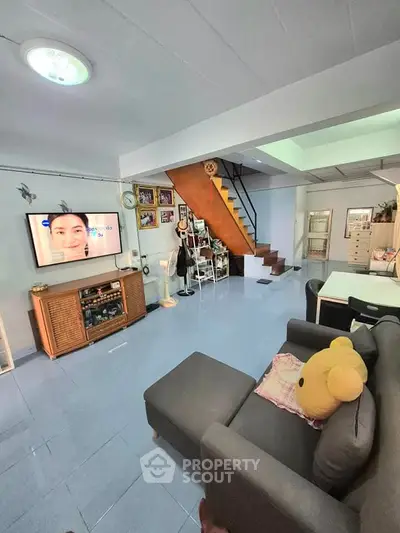 Spacious living room with modern decor and cozy seating area