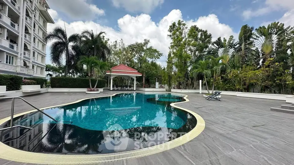 Luxurious residential pool area with lush greenery and elegant design