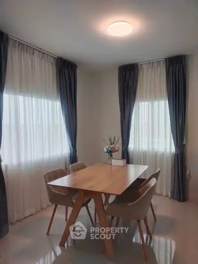 Elegant dining area with natural light and modern decor