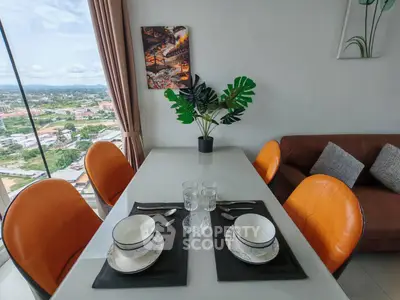 Modern dining area with panoramic city view, stylish decor, and comfortable seating.