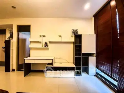 Modern living room with sleek furniture and large windows, perfect for urban living.