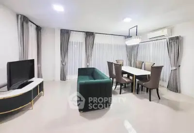 Elegant living room with modern dining area and stylish furniture