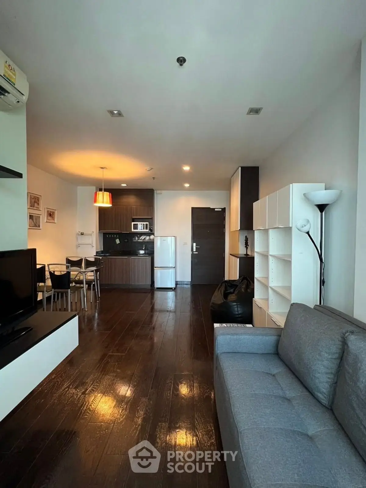 Modern living room with open kitchen and stylish decor