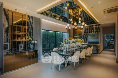 Luxurious dining room with elegant decor and large windows offering garden views.