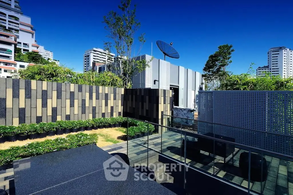 Modern rooftop terrace with sleek design and city views, perfect for urban living.