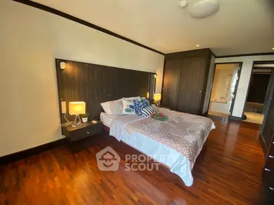Luxurious bedroom with elegant wooden flooring and stylish decor