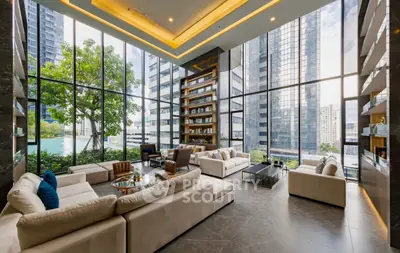 Luxurious modern living room with floor-to-ceiling windows and stunning city views.