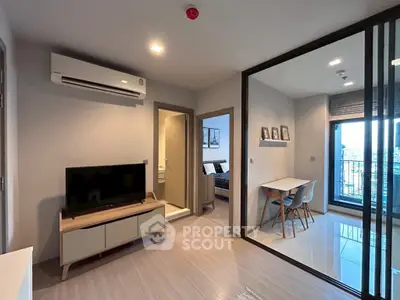 Modern apartment interior with living room, dining area, and balcony view.