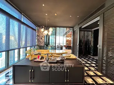 Luxurious modern living room with elegant decor and panoramic city views.