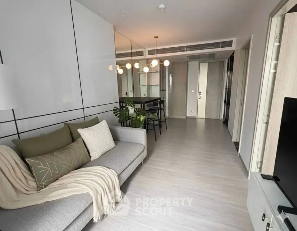 Modern living room with sleek design and cozy seating area