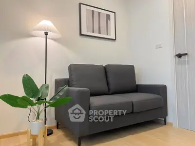 Cozy living room with modern gray sofa and stylish floor lamp