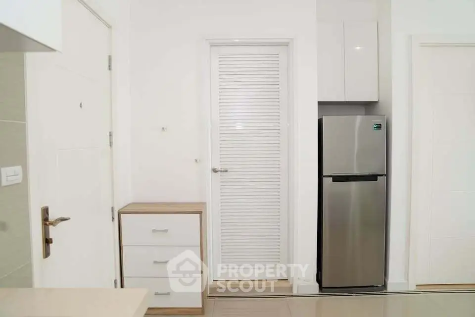 Modern kitchen with sleek fridge and minimalist design