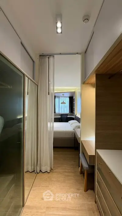 Modern bedroom with sleek wooden furniture and cozy lighting