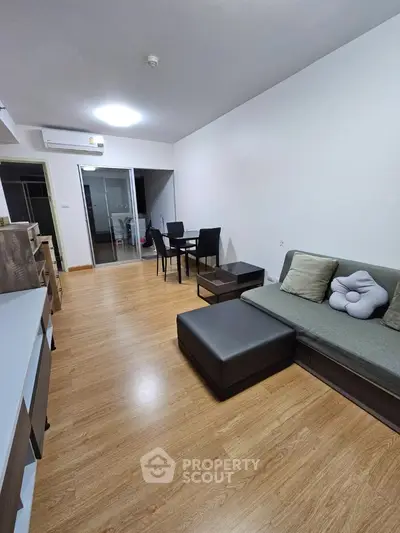 Modern living room with wooden flooring and stylish furniture