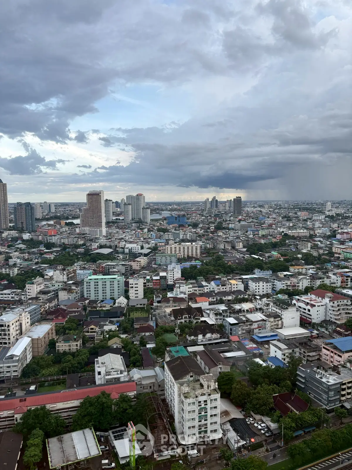 Stunning cityscape view from a high-rise building showcasing urban skyline and expansive horizon.
