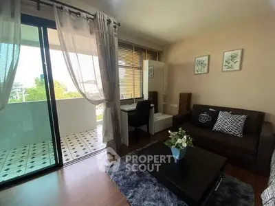 Charming living room with balcony access and stylish decor