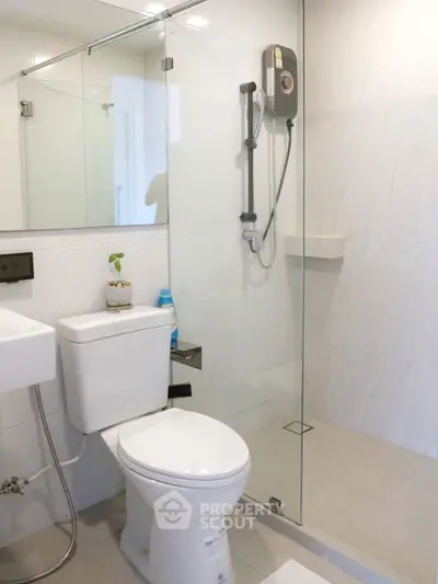 Modern bathroom with glass shower and sleek fixtures