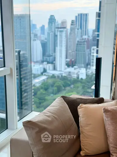 Luxurious high-rise apartment with stunning cityscape view from the living room.