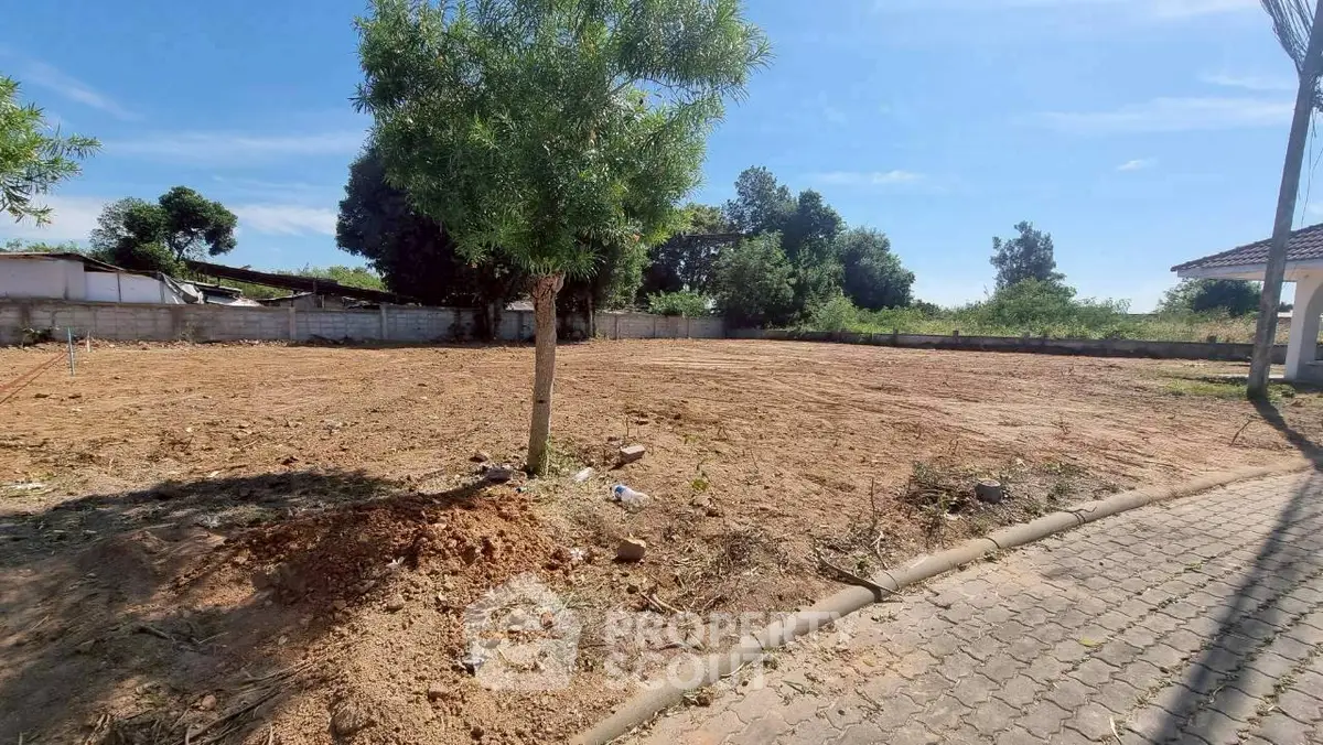 Spacious vacant land with potential for development in a serene neighborhood.