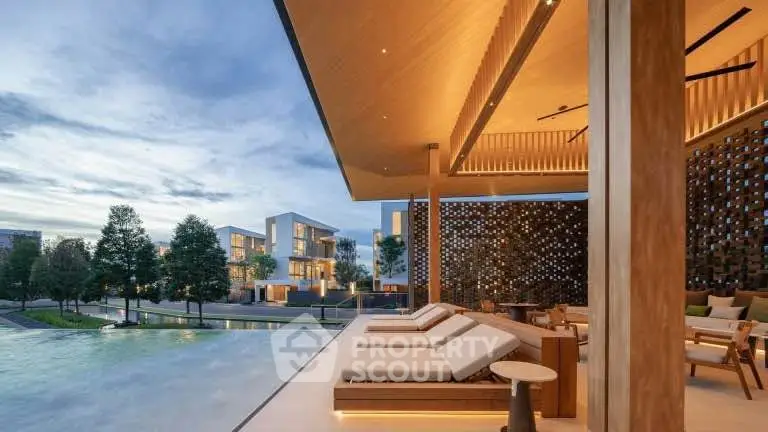 Luxurious modern poolside area with elegant loungers and stunning architectural design.