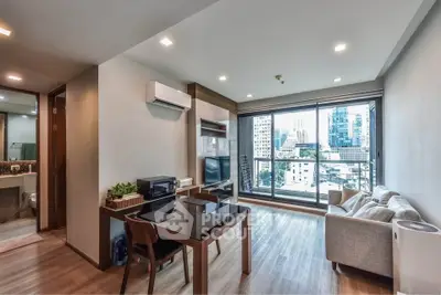 Modern living room with city view, sleek furniture, and natural light
