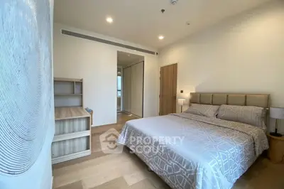Modern bedroom with stylish decor and cozy ambiance in a contemporary apartment.