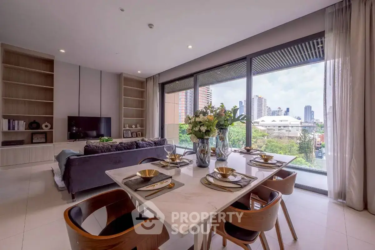 Luxurious open-plan living room with stunning city view and elegant dining area