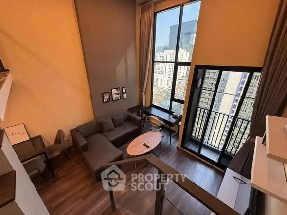 Modern high-rise apartment with stunning city view and stylish interior design.