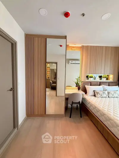 Modern bedroom with stylish decor and built-in wardrobe