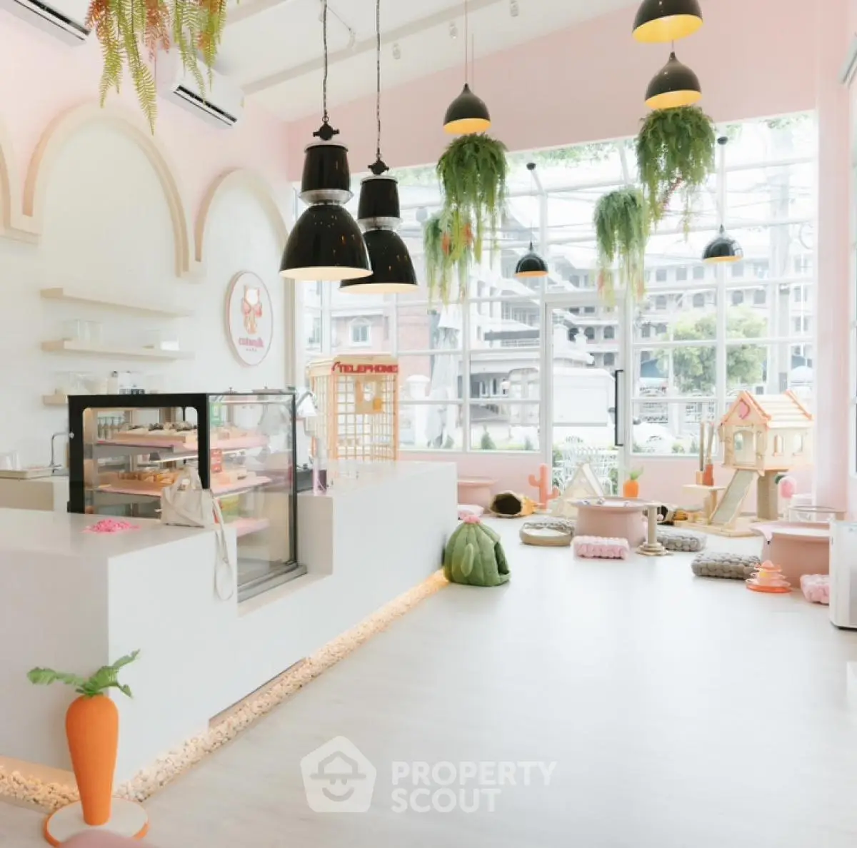 Charming pet-friendly cafe with playful decor and large windows