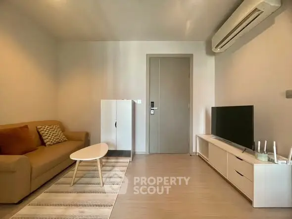 Modern living room with air conditioning and stylish furniture