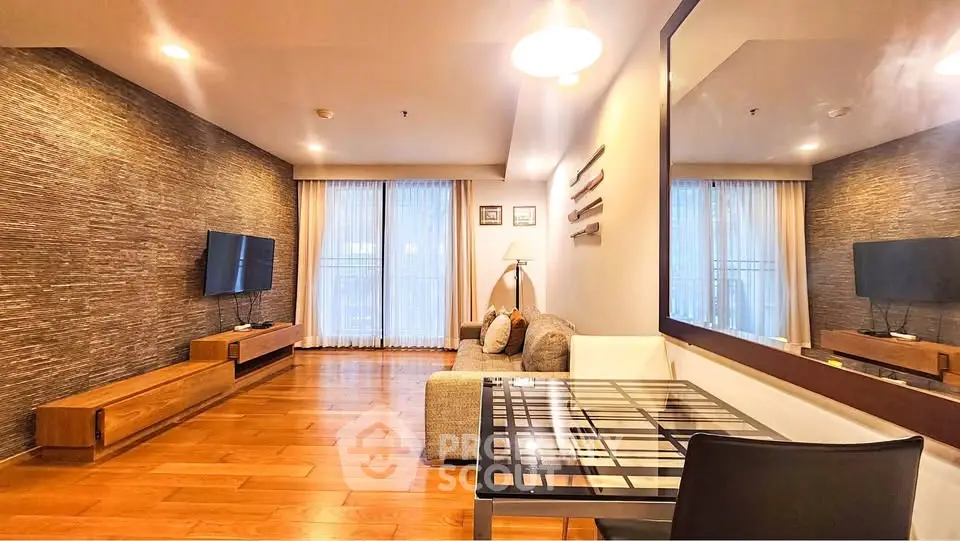 Spacious modern living room with wooden flooring and stylish decor